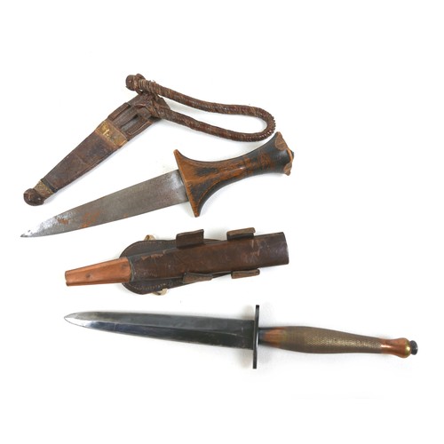 286 - A military Fairbairn Sykes style dagger, with brass handle, blade 15.7cm, 28cm overall, brown leathe... 