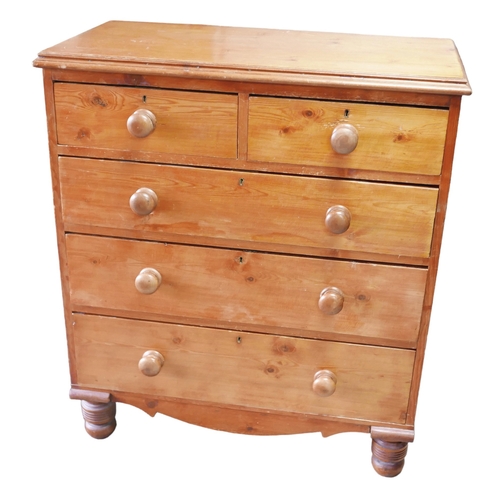 516 - A Victorian pine chest of two over three drawers, with turned handles and feet.