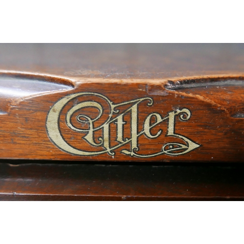 546 - An Edwardian oak roll top desk by Cutler, with fitted interior including pen and ink well holder, pi... 