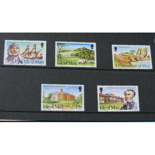 203 - A collection of Isle of Man stamps and FDCs, including four albums. (1 box)