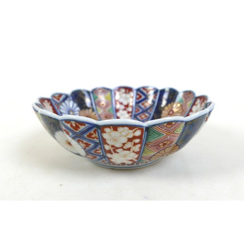 25 - A Japanese Imari pottery bowl, of chrysanthemum form, six character mark to base, 18 by7cm high, tog... 