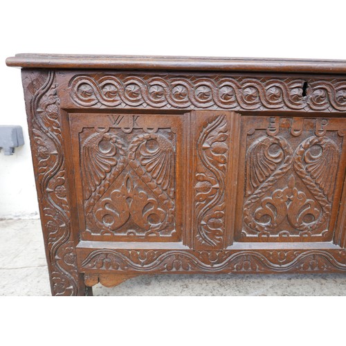 604 - A 17th century oak coffer, carved three panel front with initials 'W K' and 'E J P', and date '1661'... 