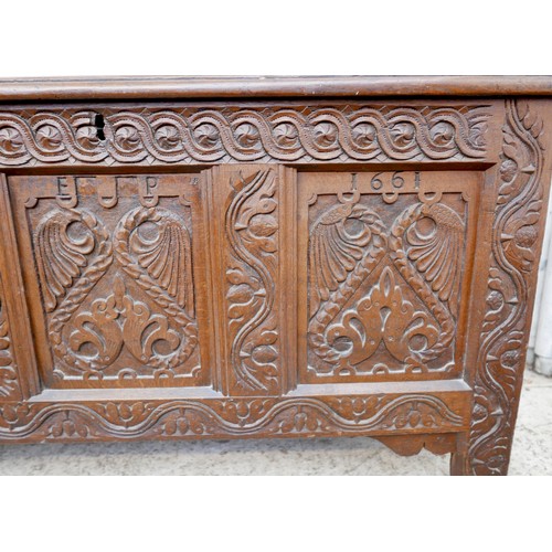 604 - A 17th century oak coffer, carved three panel front with initials 'W K' and 'E J P', and date '1661'... 