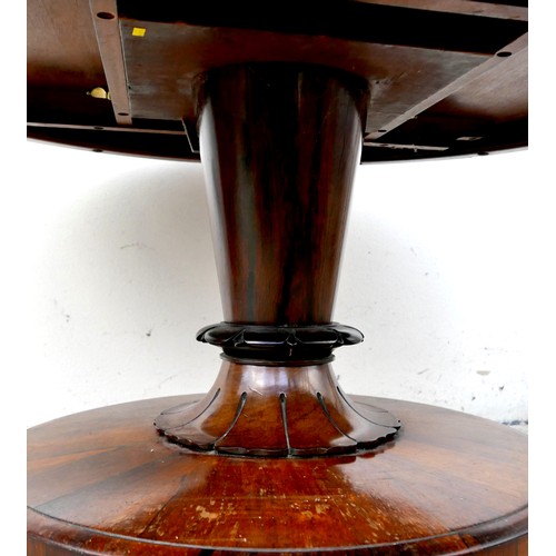 556 - A William IV rosewood breakfast table, circular tilt top on an turned column with lappet carving, ra... 