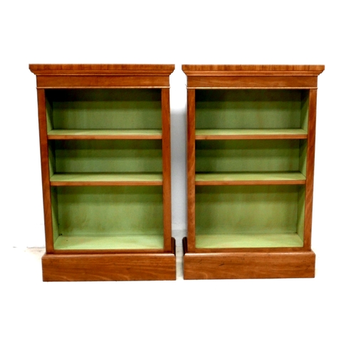 558 - A pair of new walnut freestanding bookcases, each with two shelves and painted green internally, 61 ... 