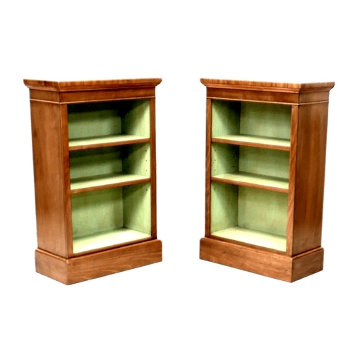 558 - A pair of new walnut freestanding bookcases, each with two shelves and painted green internally, 61 ... 