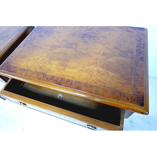 561 - A new pair of walnut lamp tables, each with single frieze drawer and ring handles, raised on turned ... 