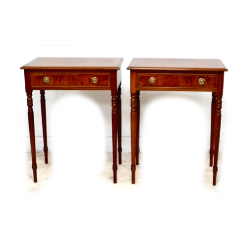 561 - A new pair of walnut lamp tables, each with single frieze drawer and ring handles, raised on turned ... 