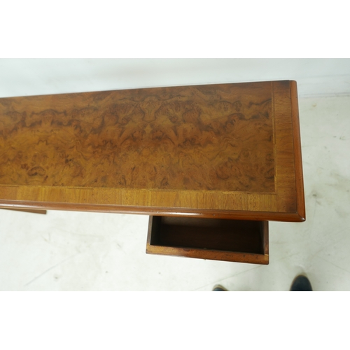 560 - A walnut hall table, with four frieze drawers and ring handles, raised on square section legs, 126 b... 