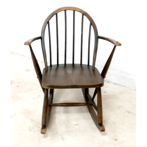 480 - An Ercol stained beech rocking chair, with low stick back, 61 by 76 by 74cm high.