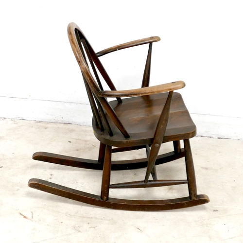 480 - An Ercol stained beech rocking chair, with low stick back, 61 by 76 by 74cm high.