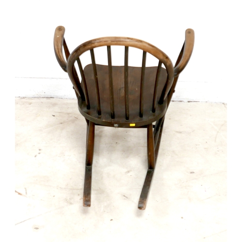 480 - An Ercol stained beech rocking chair, with low stick back, 61 by 76 by 74cm high.