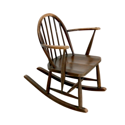 480 - An Ercol stained beech rocking chair, with low stick back, 61 by 76 by 74cm high.