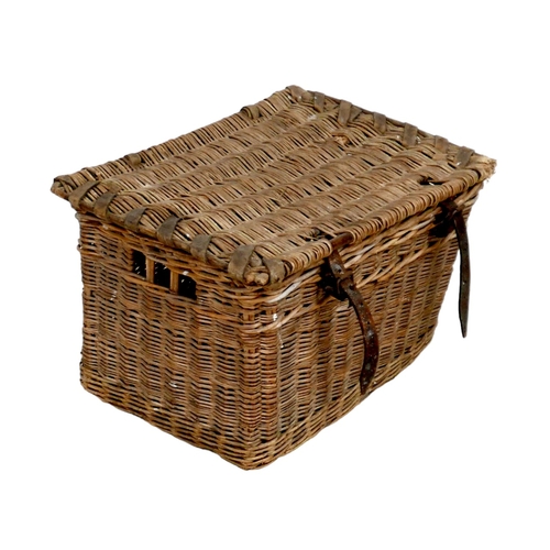 310 - A vintage wicker hamper, with brown leather straps, 65 by 44 by 39cm high.