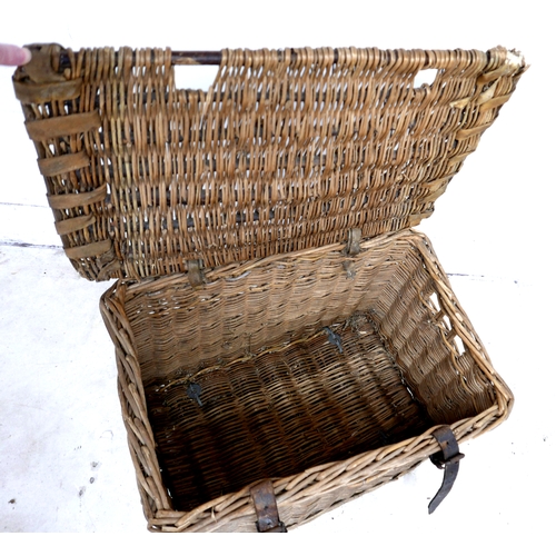 310 - A vintage wicker hamper, with brown leather straps, 65 by 44 by 39cm high.