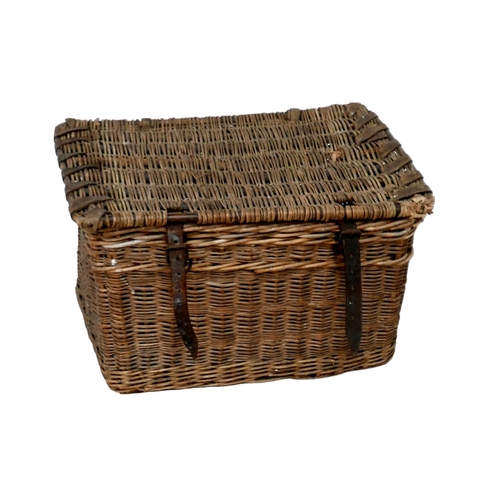 310 - A vintage wicker hamper, with brown leather straps, 65 by 44 by 39cm high.