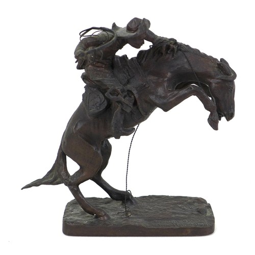 125 - A Franklin Mint bronze resin sculpture, 'Broncho Buster', after Frederic Remington, 16 by 5 by 17cm ... 