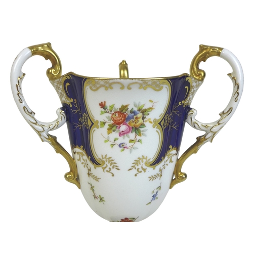 86 - An Edwardian Coalport porcelain goblet-vase, shape 144, modelled with three handles, flared rim, on ... 