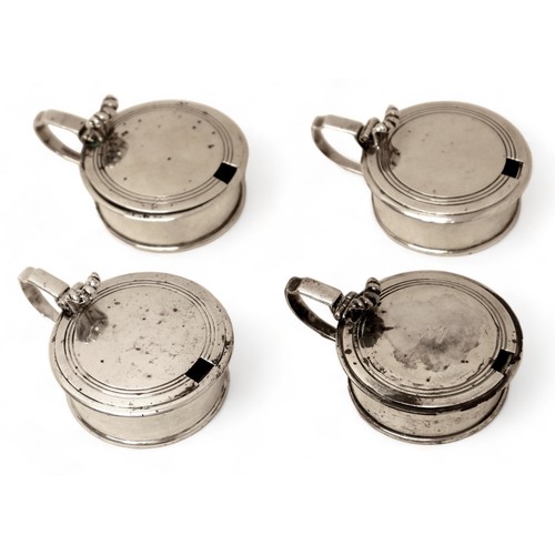 71 - A group of four silver mustards, two with glass liners, each 10 by 7.5 by 4.5cm high, 18.2toz. (4)