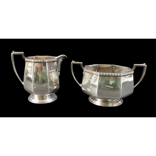 2 - A George V silver four piece tea service, each of eight sided bellied form with decorative border to... 