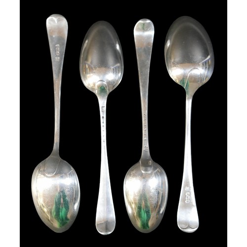 64 - Four 19th century silver table spoons, two with initials 'JS' to finials, rubbed hallmarks, together... 