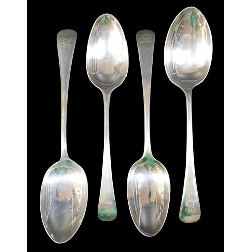 64 - Four 19th century silver table spoons, two with initials 'JS' to finials, rubbed hallmarks, together... 