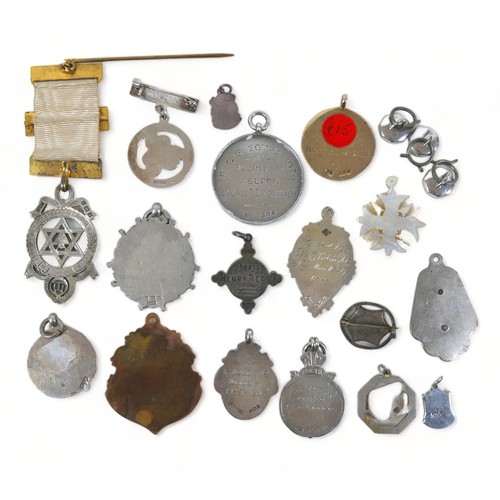 15 - A collection of silver medallions and fobs, including a cased 1931, Metropolitan Academy of Music fo... 