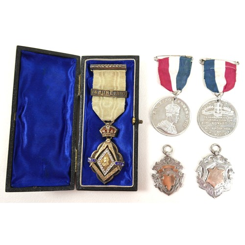 66 - A Queen Victoria commemorative silver gilt Masonic medal, bearing dates 1837-1897 with ribbon and cl... 