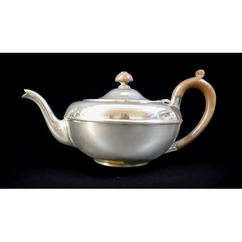 70 - An Edwardian silver teapot, of squat form, with brown bakelite handle and finial, Charles & Richard ... 