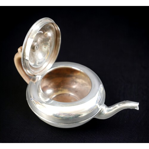 70 - An Edwardian silver teapot, of squat form, with brown bakelite handle and finial, Charles & Richard ... 