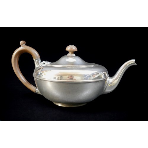 70 - An Edwardian silver teapot, of squat form, with brown bakelite handle and finial, Charles & Richard ... 