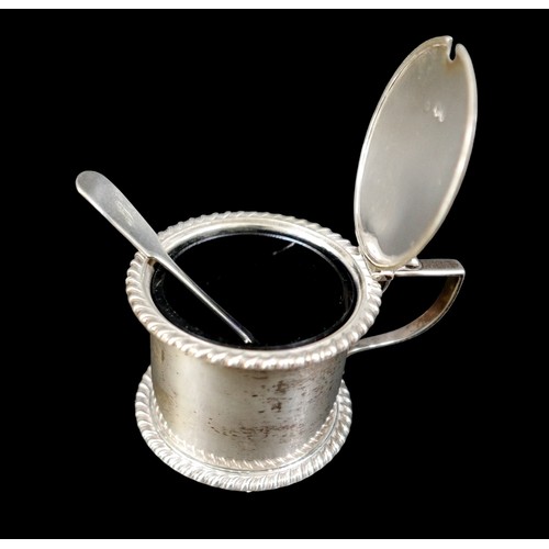 9 - A silver mustard, with blue glass liner and a plated spoon, late 19th / early 20th century, Thomas B... 