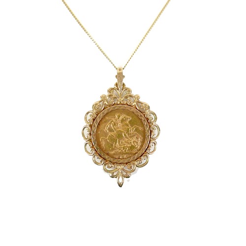 93 - An Edward VII gold sovereign, 1907, in 9ct gold pendant mount, 31 by 49mm, and on a yellow metal tra... 