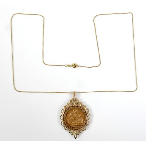 93 - An Edward VII gold sovereign, 1907, in 9ct gold pendant mount, 31 by 49mm, and on a yellow metal tra... 