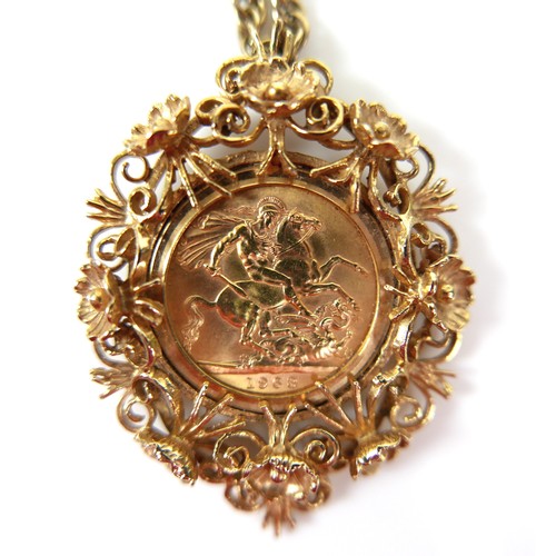 105 - An Elizabeth II gold sovereign, 1963, mounted in a 9ct gold ornate floral and scrolling pendant moun... 