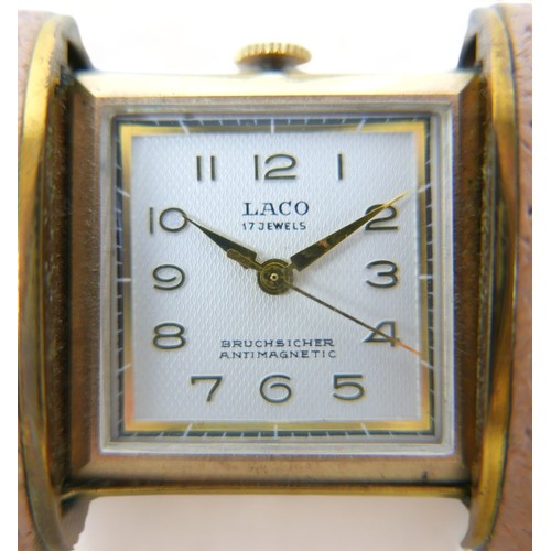 119 - A Laco 17 jewel manual wind purse/bedside watch in a pull out leather case