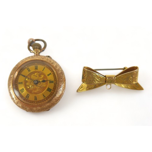 113 - A Continental 14k yellow gold lady's pocket watch, open faced, key wind, 31mm, 22.4g gross, together... 