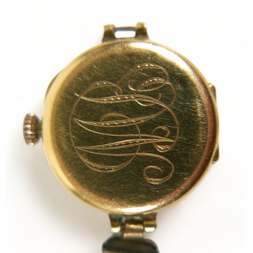 133 - An 18ct gold cased lady's wristwatch, with Arabic dial, 15 jewel Swiss movement, monogram 'MB' to ba... 