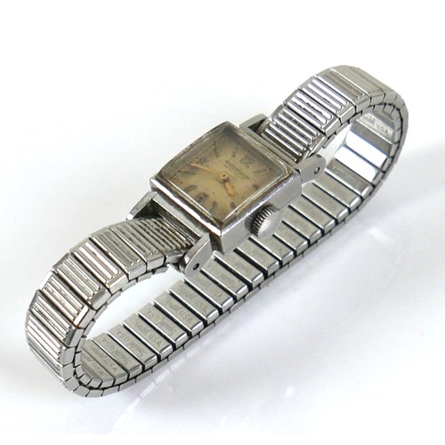 136 - A vintage Jaeger LeCoultre lady's wristwatch, with square steel case, square 3.6.9.12 Arabic dial, i... 