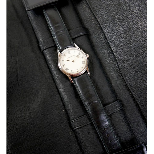 147 - A Theo Fennell 18ct white gold gentleman's wristwatch, circular cream dial with black Roman numerals... 