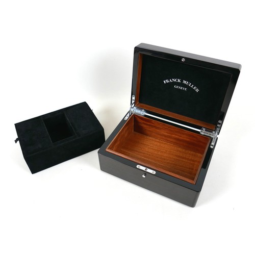 120 - An exotic wood watch box, branded for 'Franck Muller, Geneve', with fitted interior and chromed meta... 