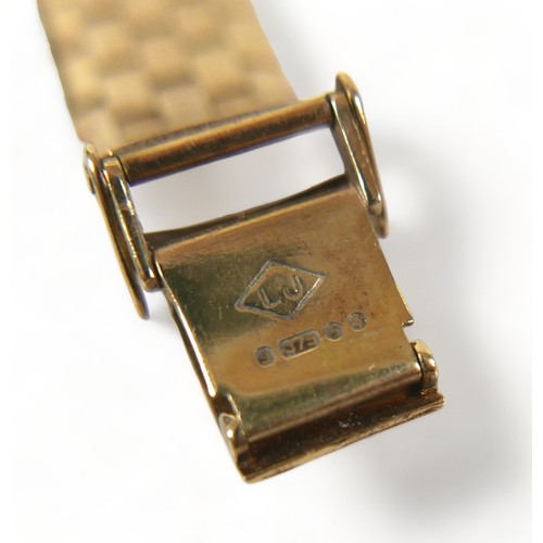 142 - A Bentima Star 9ct gold lady's wristwatch, circa 1970's, small rectangular silvered dial set in a te... 