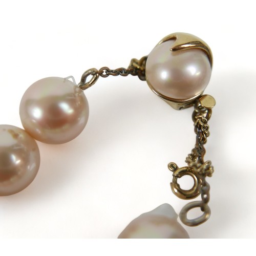 164 - A pearl necklace with a 9ct yellow gold clasp 44cm long and two other necklaces.