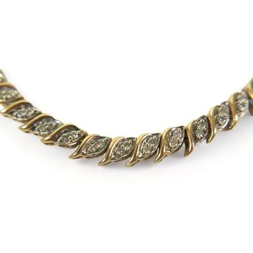 244 - A 14ct yellow gold diamond bracelet, 18cm long 4mm wide, 9.80 grams.