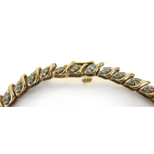 244 - A 14ct yellow gold diamond bracelet, 18cm long 4mm wide, 9.80 grams.