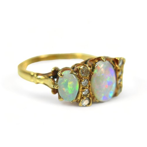 258 - A hallmarked 18ct yellow gold opal and diamond ring, the central stone 8mm by 5mm, ring size P, 4.4 ... 