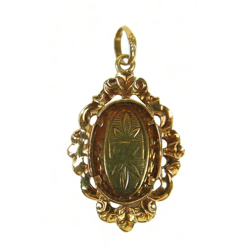 207 - An 18ct pendant 1.9 grams 25mm by 12mm, a gilt brooch and a gilt mounted cameo brooch, both4.4 grams