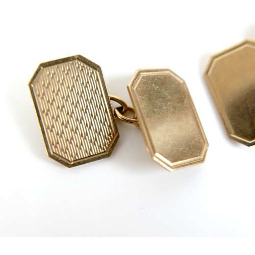 200 - A pair of vintage 9ct gold cufflinks, of canted rectangular form with engraved decoration, chain lin... 