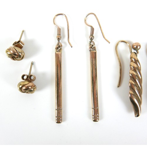 265 - A group of four pairs of 9ct yellow gold earrings, one pair of drop bar design, 38mm long, and a pai... 