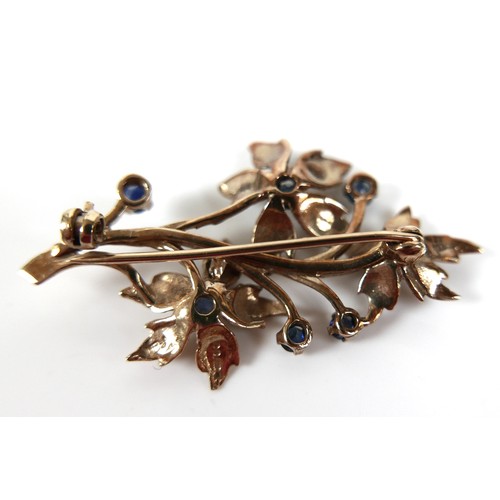 264 - A small group of 9ct gold jewellery, comprising a sapphire set floral spray brooch, a tie pin, a cam... 